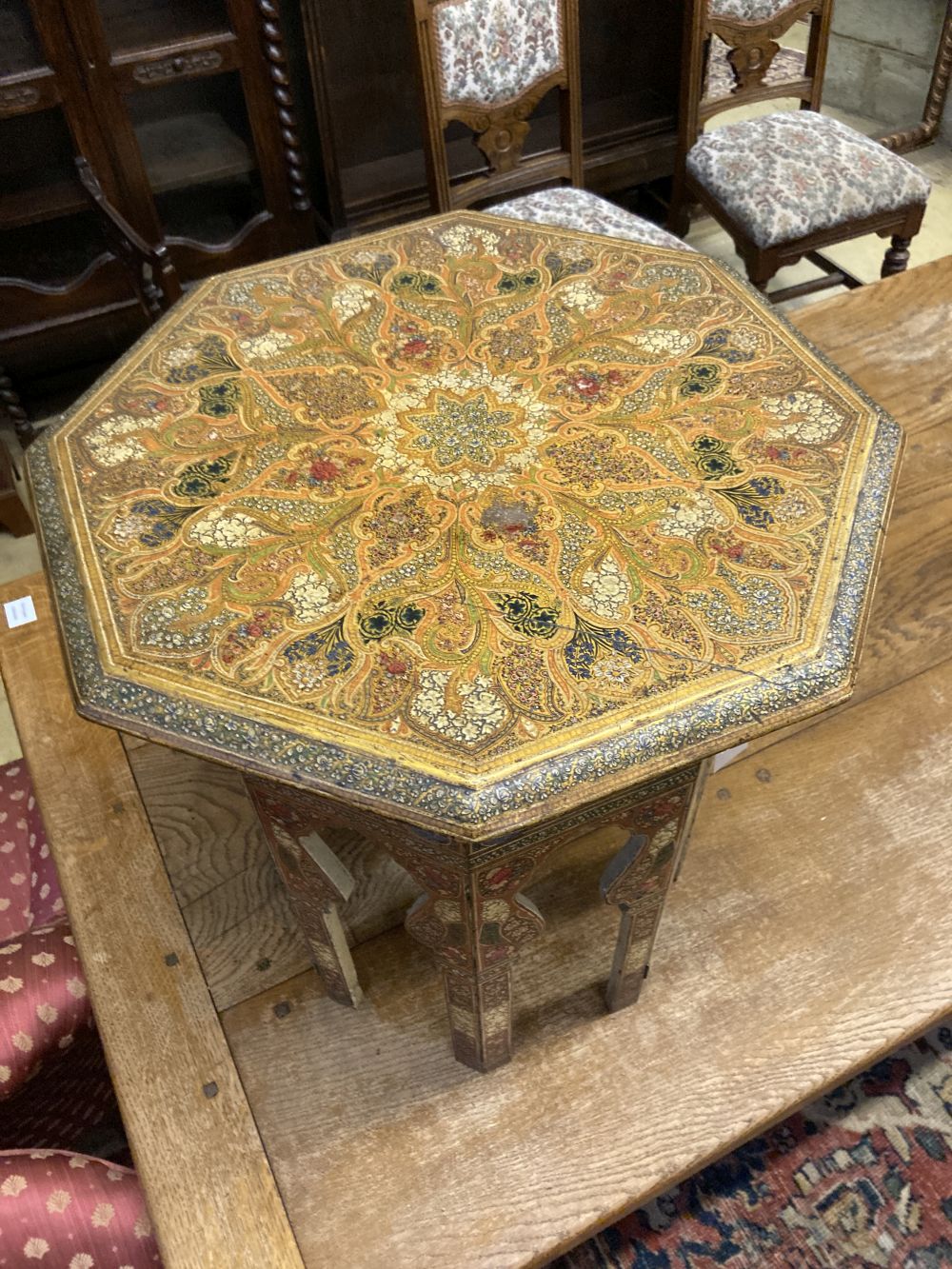 An Indian octagonal painted occasional table, width 50cm height 54cm